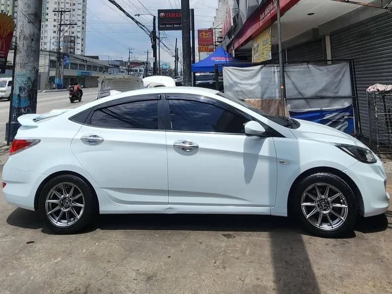 White Hyundai Accent on silver mags