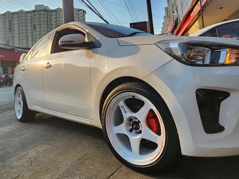 White Kia Picanto on white mags with red calipers