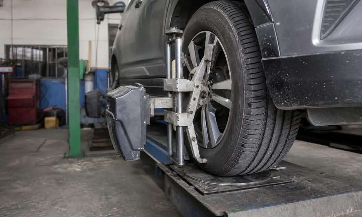 Wheel alignment equipment fitted to a vehicle in a service bay
